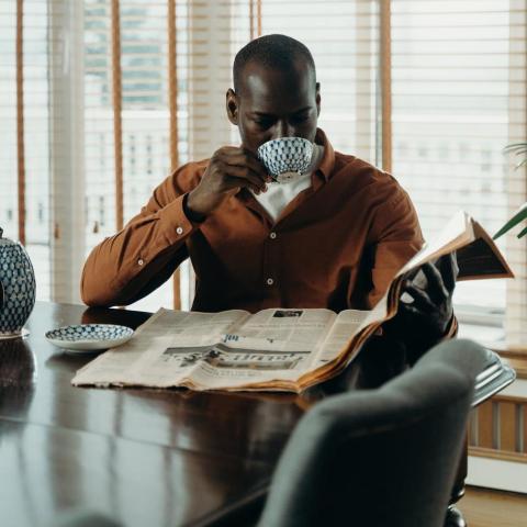 Man reading newspaper
